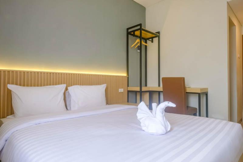 Postel nebo postele na pokoji v ubytování Upcity Hotel Simpang Lima By Sajiwa