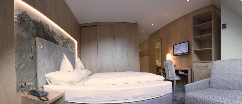 Postel nebo postele na pokoji v ubytování Hotel Gramaser