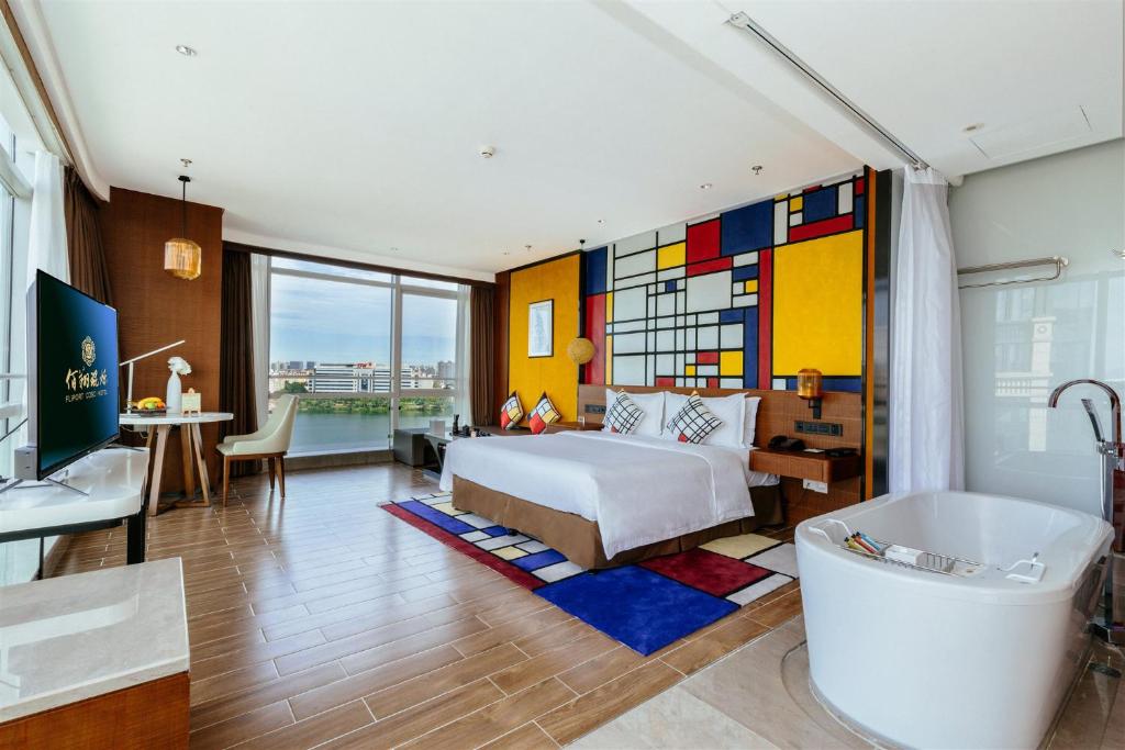 Postel nebo postele na pokoji v ubytování Hisilk Artwork Center Fliport Coso Hotel
