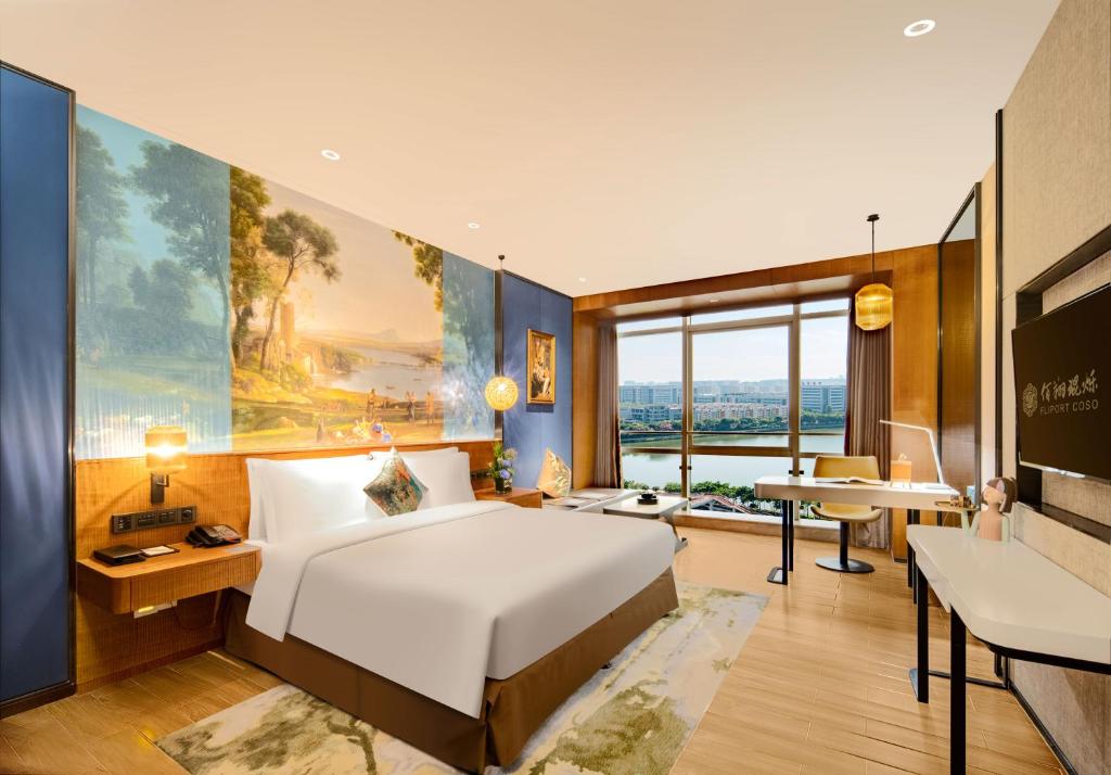 Postel nebo postele na pokoji v ubytování Hisilk Artwork Center Fliport Coso Hotel