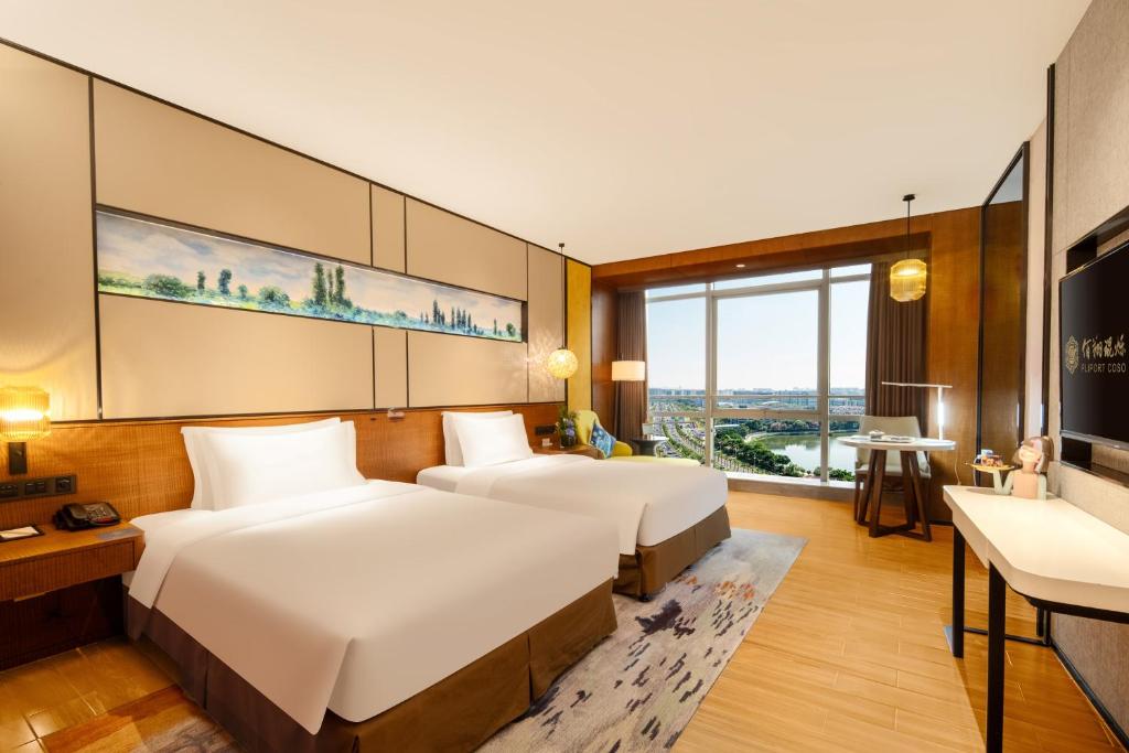 Postel nebo postele na pokoji v ubytování Hisilk Artwork Center Fliport Coso Hotel
