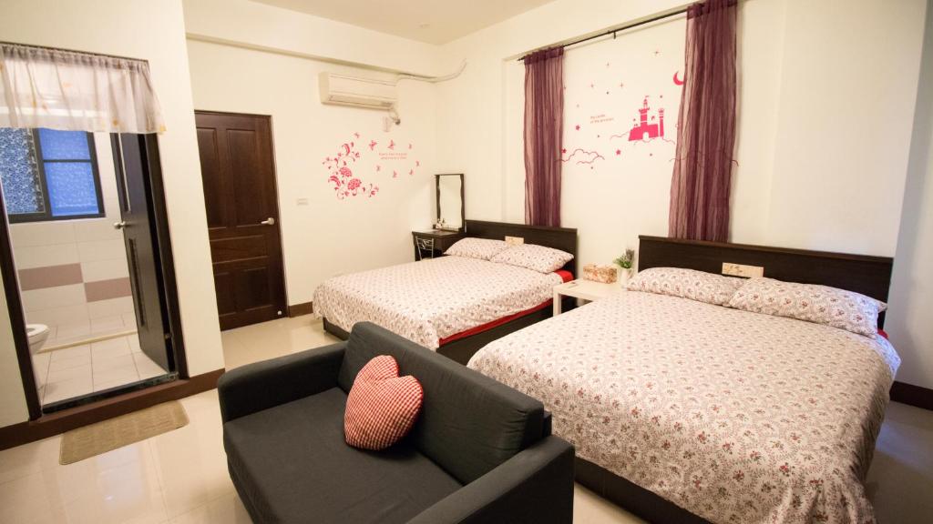 Postel nebo postele na pokoji v ubytování Fu Taitung Homestay