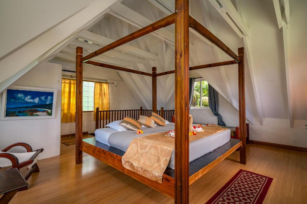 Postel nebo postele na pokoji v ubytování Lemongrass Lodge