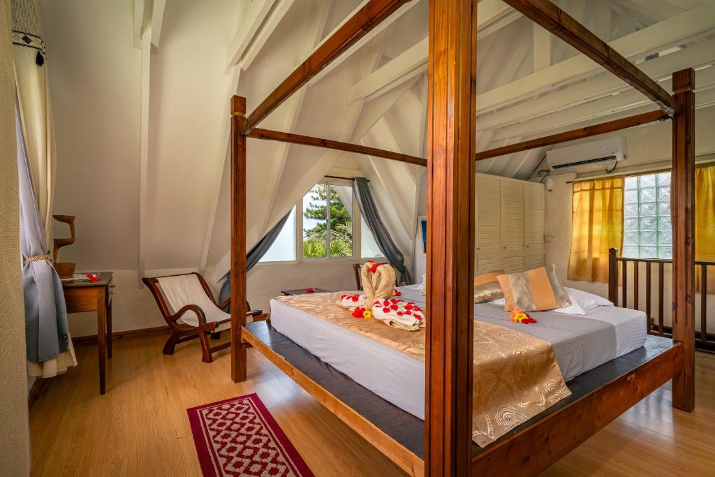 Postel nebo postele na pokoji v ubytování Lemongrass Lodge