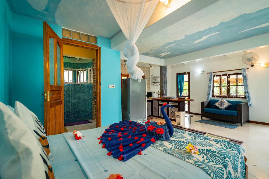 Postel nebo postele na pokoji v ubytování Lemongrass Lodge