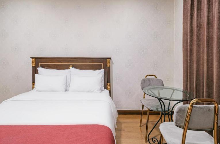 Postel nebo postele na pokoji v ubytování Seogwipo Milano