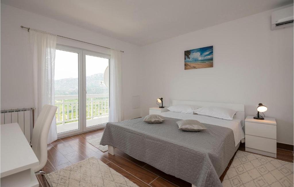 Posteľ alebo postele v izbe v ubytovaní Four-Bedroom Holiday Home In Veliki Prolog