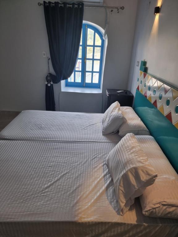 Postel nebo postele na pokoji v ubytování Baba Dool