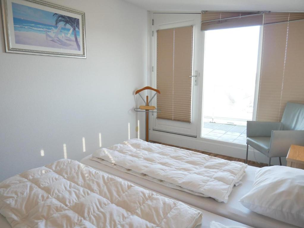 Postel nebo postele na pokoji v ubytování Het Strandleven