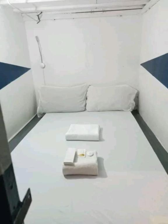 Postel nebo postele na pokoji v ubytování RDC - Mariveles Transient Capsule