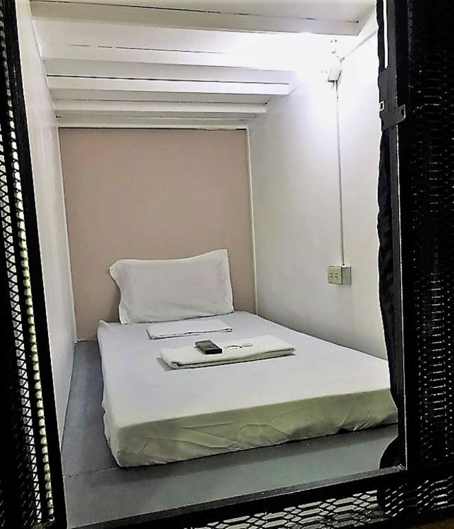 Postel nebo postele na pokoji v ubytování RDC - Mariveles Transient Capsule