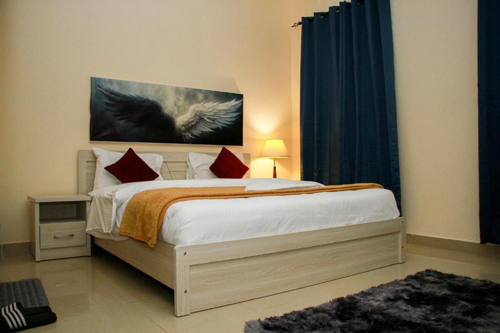Postel nebo postele na pokoji v ubytování THAAL Rooms Sharjah