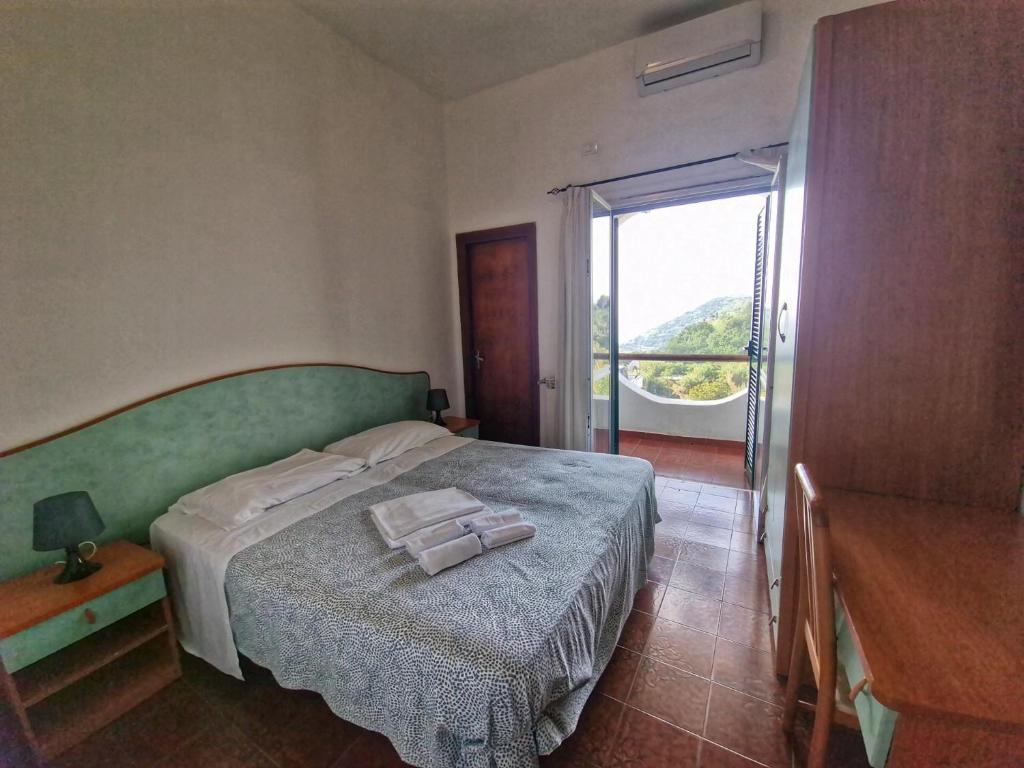 Postel nebo postele na pokoji v ubytování Hotel Bellavista