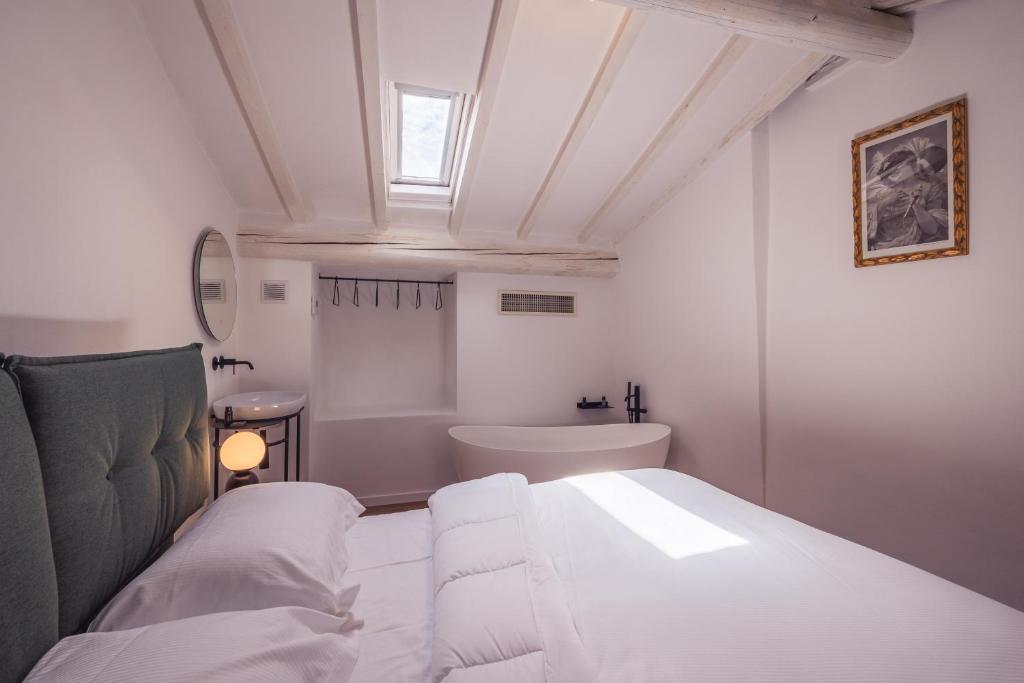 Postel nebo postele na pokoji v ubytování Suite Design & Spa