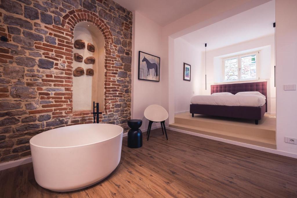 Postel nebo postele na pokoji v ubytování Suite Design & Spa