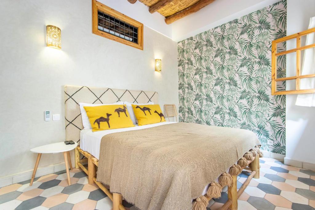 Postel nebo postele na pokoji v ubytování Riad Les Suites Marrakech