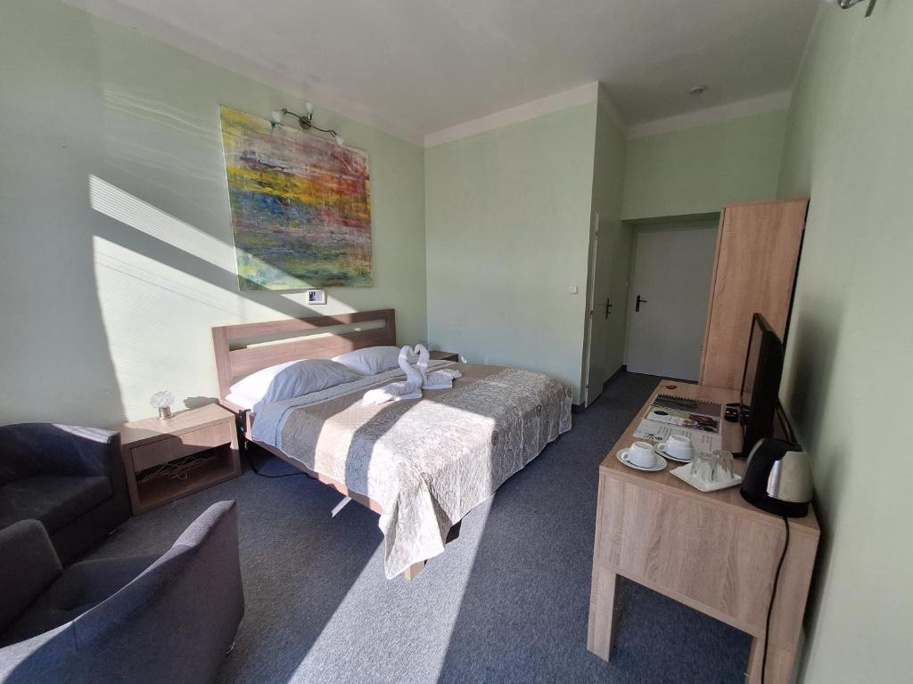 Postel nebo postele na pokoji v ubytování Lázně Meziboří
