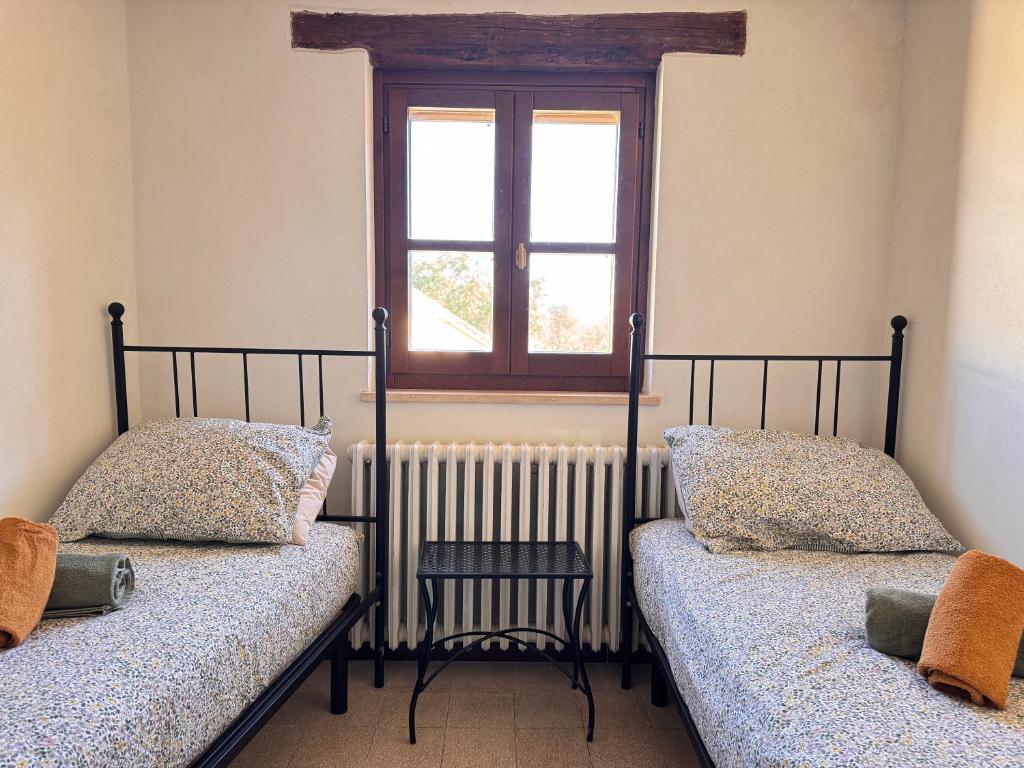 Postel nebo postele na pokoji v ubytování Casa Montecastelli Sopra/Terra