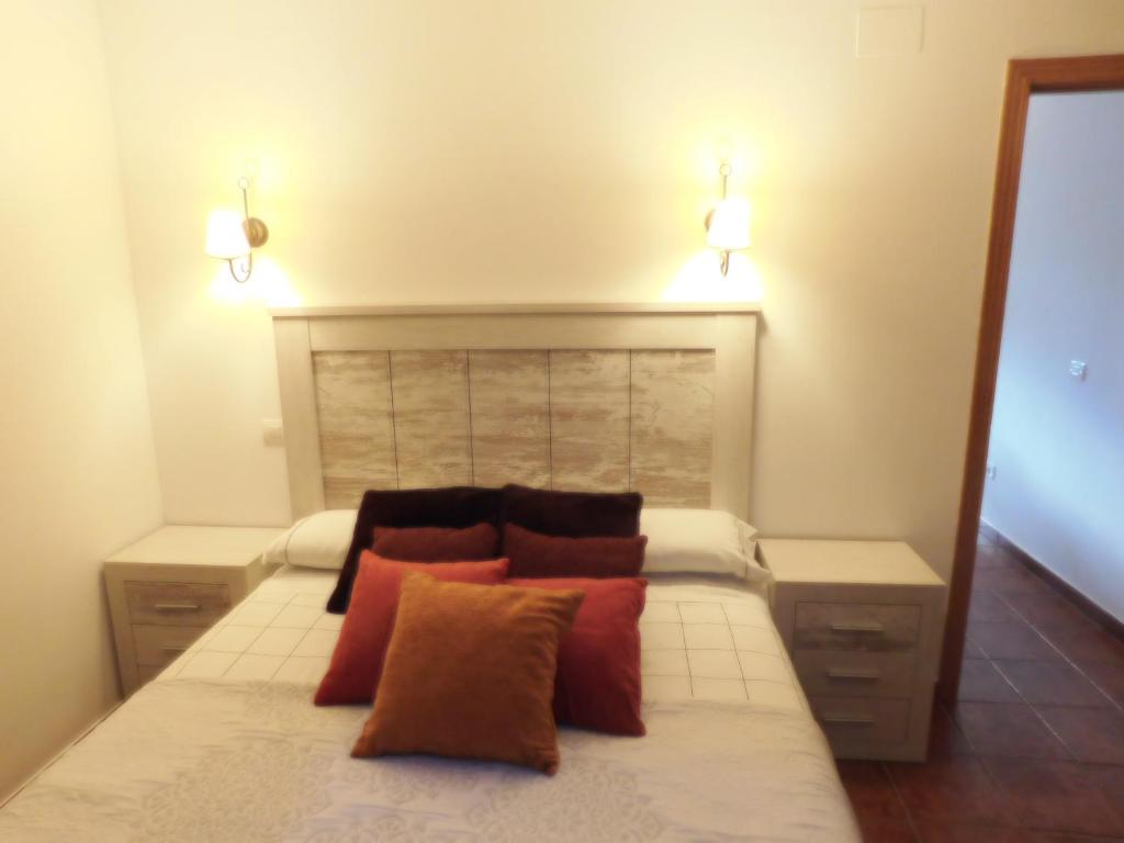 En eller flere senge i et værelse på Apartamento LA CORREDERA