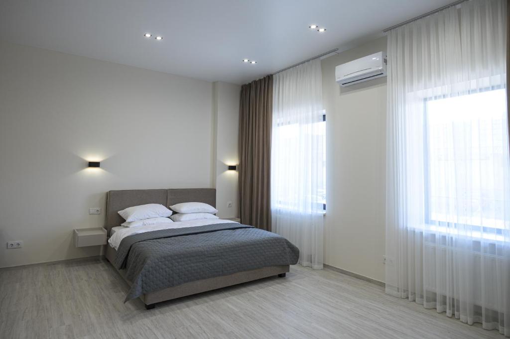 Postel nebo postele na pokoji v ubytování REST INN apart hotel