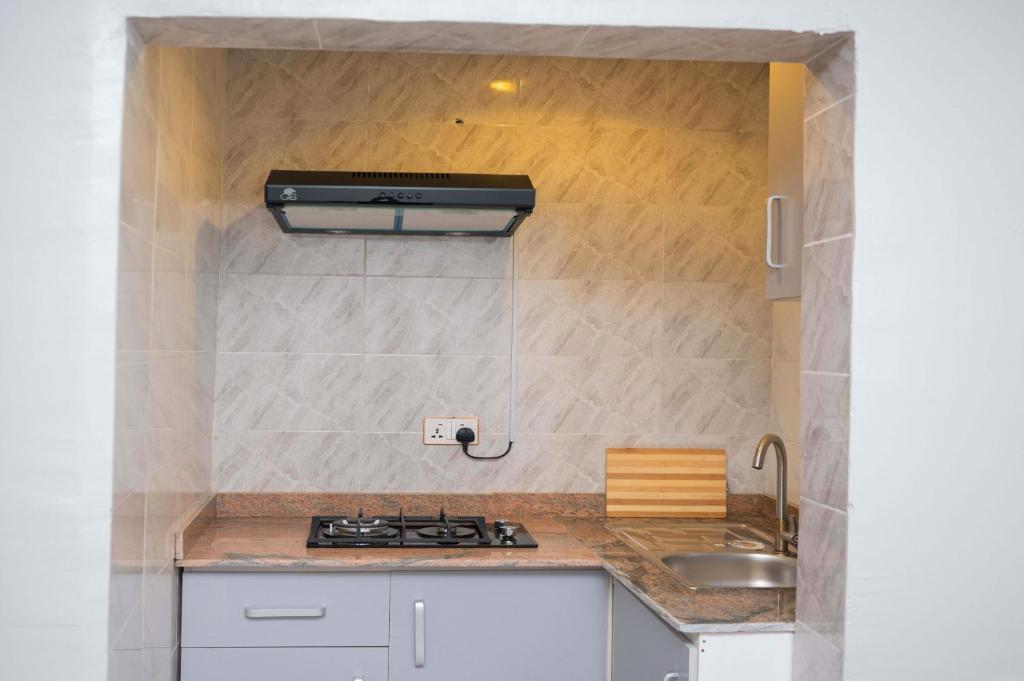 Kuchyň nebo kuchyňský kout v ubytování Goodis Apartments Ajah