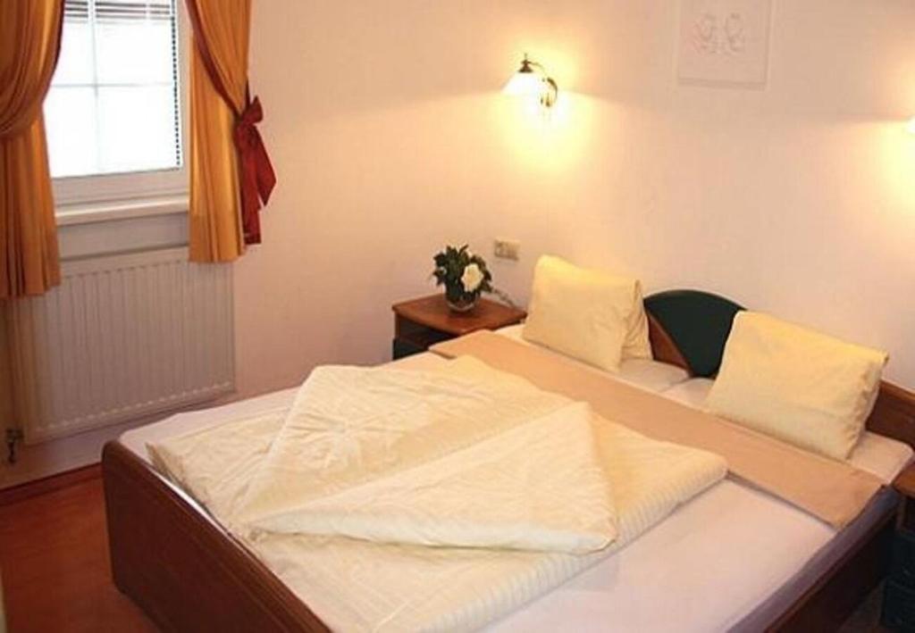 Posteľ alebo postele v izbe v ubytovaní Apartments Martin