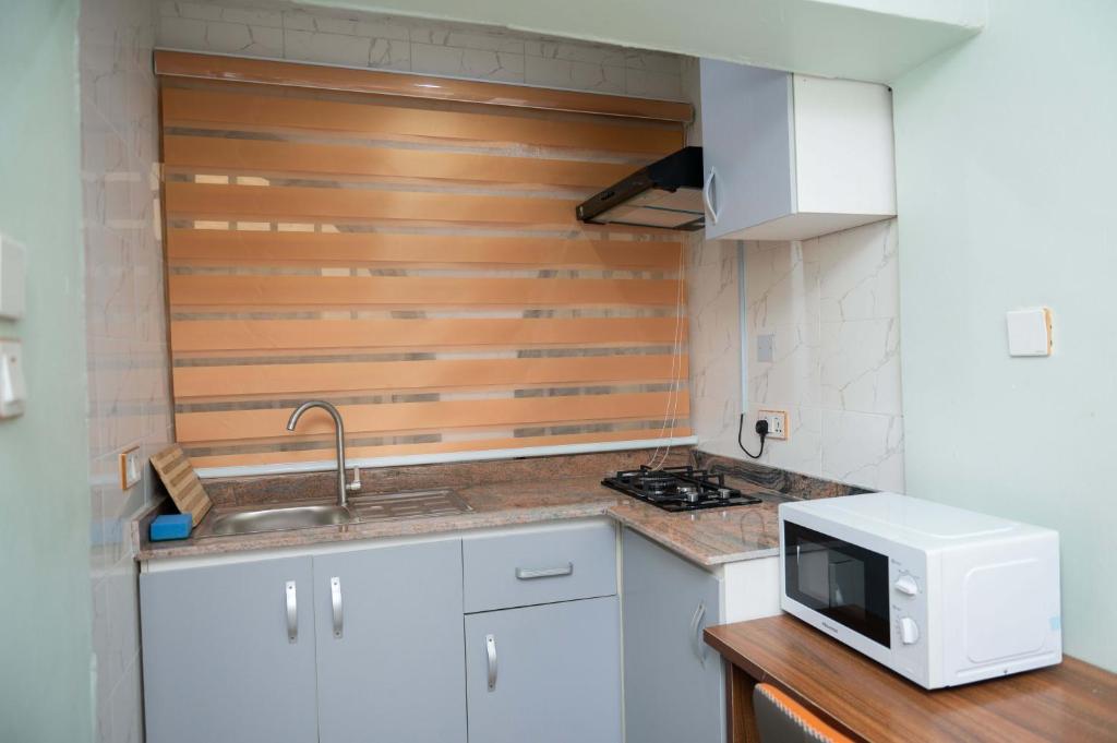 Kuchyň nebo kuchyňský kout v ubytování Goodis Apartments Ajah