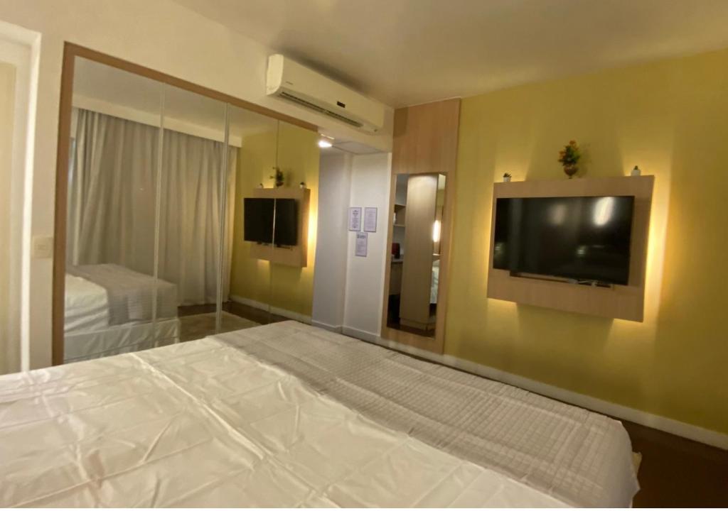 Postel nebo postele na pokoji v ubytování uma joia no Hotel Mercure Manaus