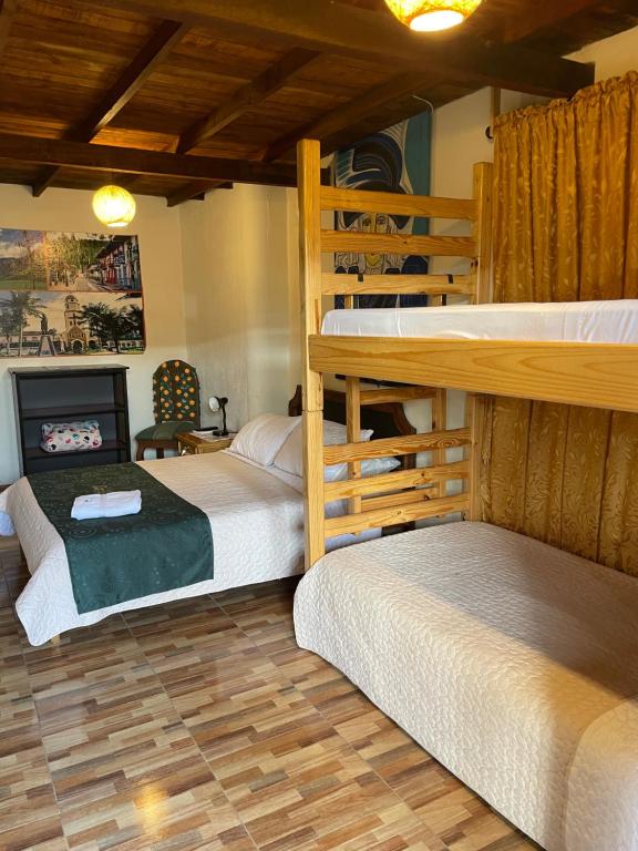 Postel nebo postele na pokoji v ubytování Aroma Cafetera