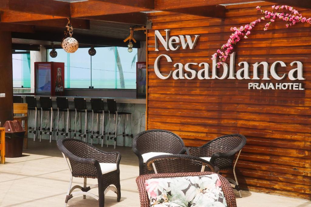 a restaurant with chairs and a sign that reads new casablanca at New Casablanca Praia Hotel in Paulista