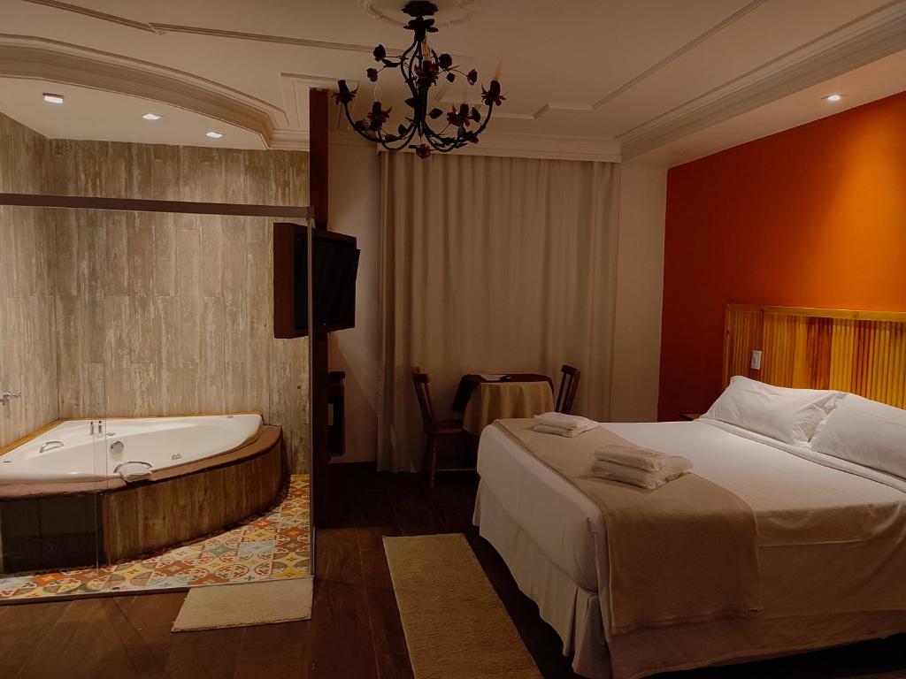 Postel nebo postele na pokoji v ubytování Hotel Ascona