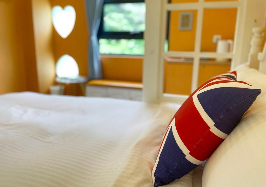 Postel nebo postele na pokoji v ubytování 岩川森林民宿 Springcreek B&B
