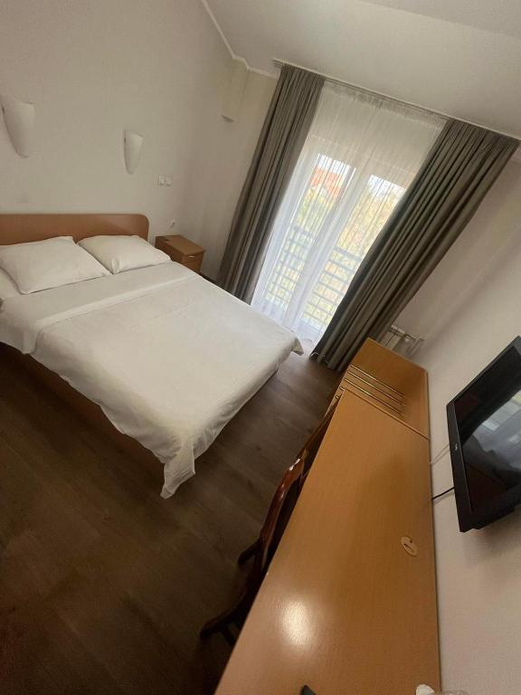 Postel nebo postele na pokoji v ubytování Hotel Elegance