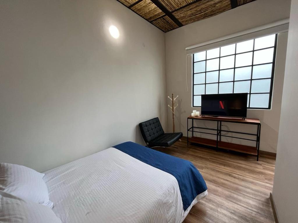 Postel nebo postele na pokoji v ubytování Casa 121, calle 121 no 7-18