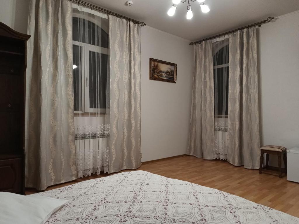 Postel nebo postele na pokoji v ubytování Вілла Токай