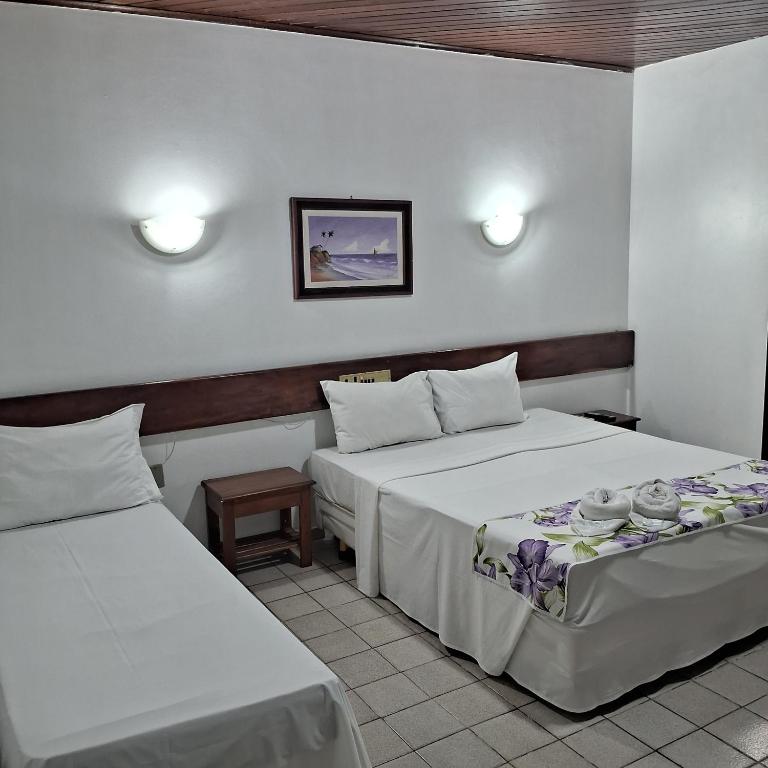 Postel nebo postele na pokoji v ubytování Hotel Costa Verde