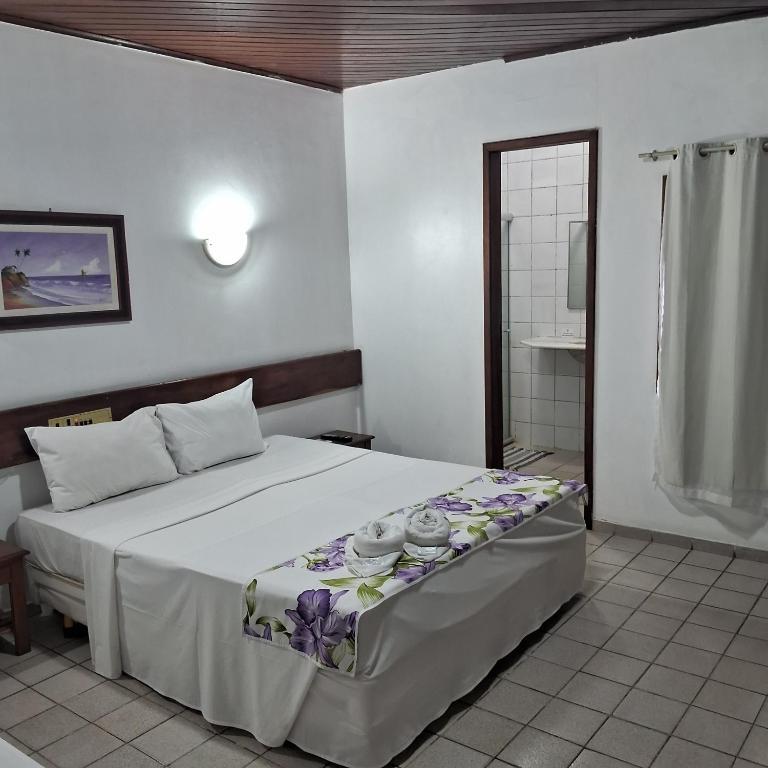 Postel nebo postele na pokoji v ubytování Hotel Costa Verde