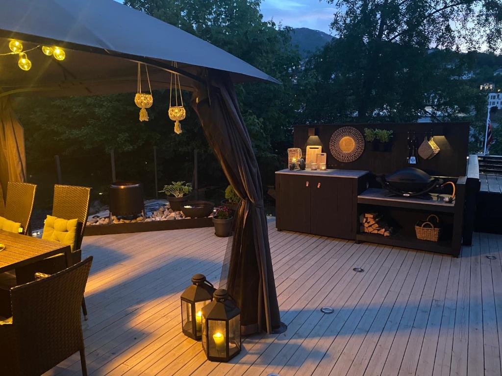 a gazebo with a table and a grill at Koie Holiday Home 3 in Stranda