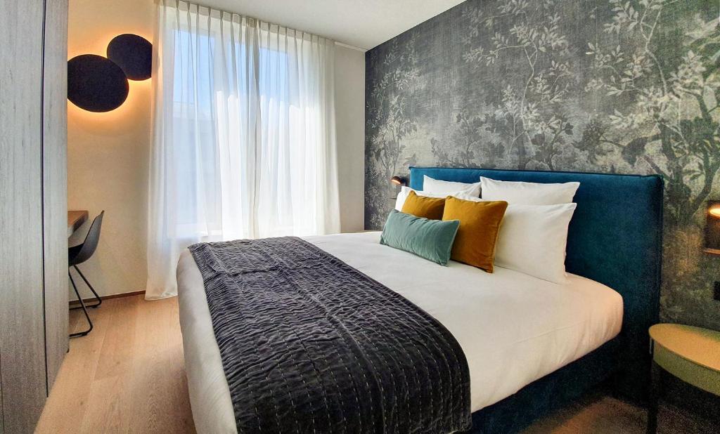 Postel nebo postele na pokoji v ubytování The Central City - Luxury Serviced Residence