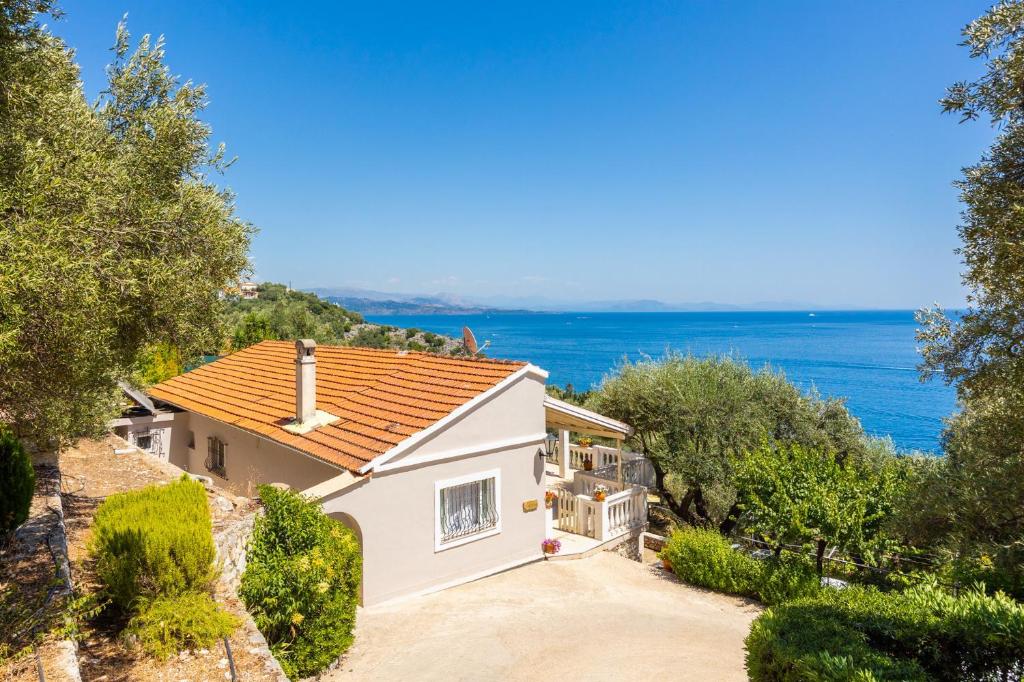 a house with a view of the ocean at Villa Theodora in Nisaki