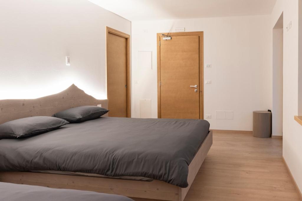 Postel nebo postele na pokoji v ubytování Ristorante e B&B IN SELLA
