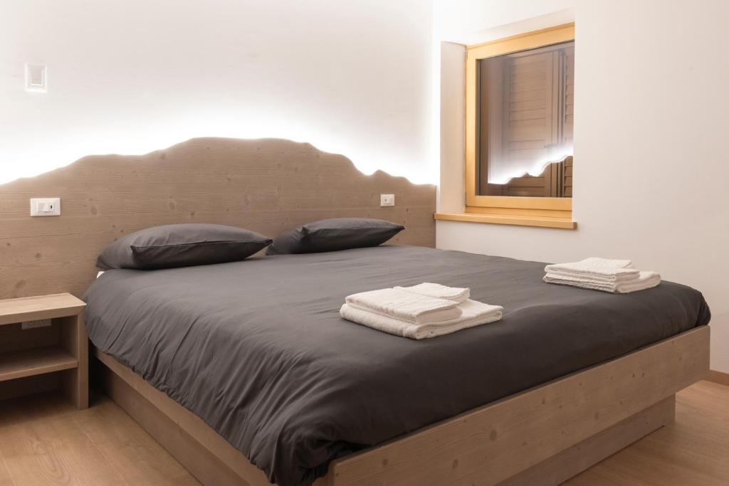 Postel nebo postele na pokoji v ubytování Ristorante e B&B IN SELLA