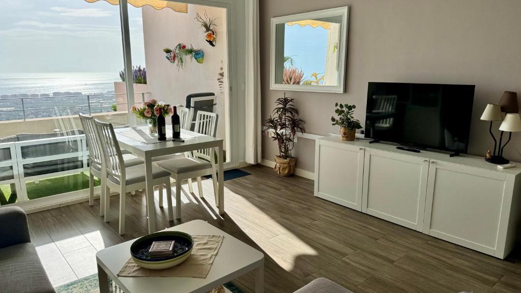 Televízia a/alebo spoločenská miestnosť v ubytovaní Casa del mar