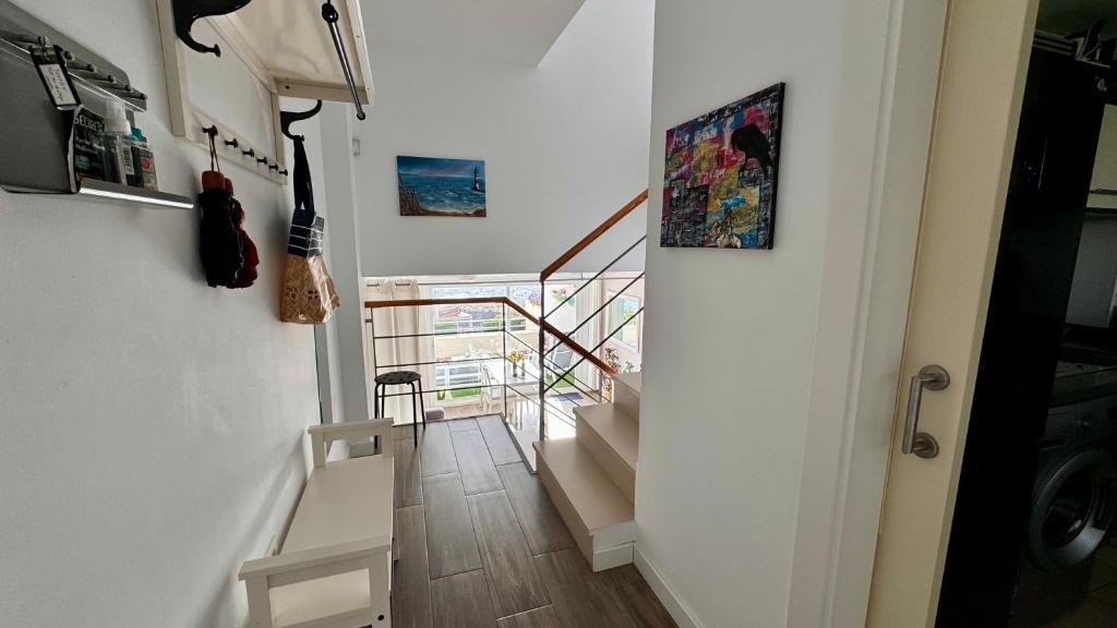 Televízia a/alebo spoločenská miestnosť v ubytovaní Casa del mar