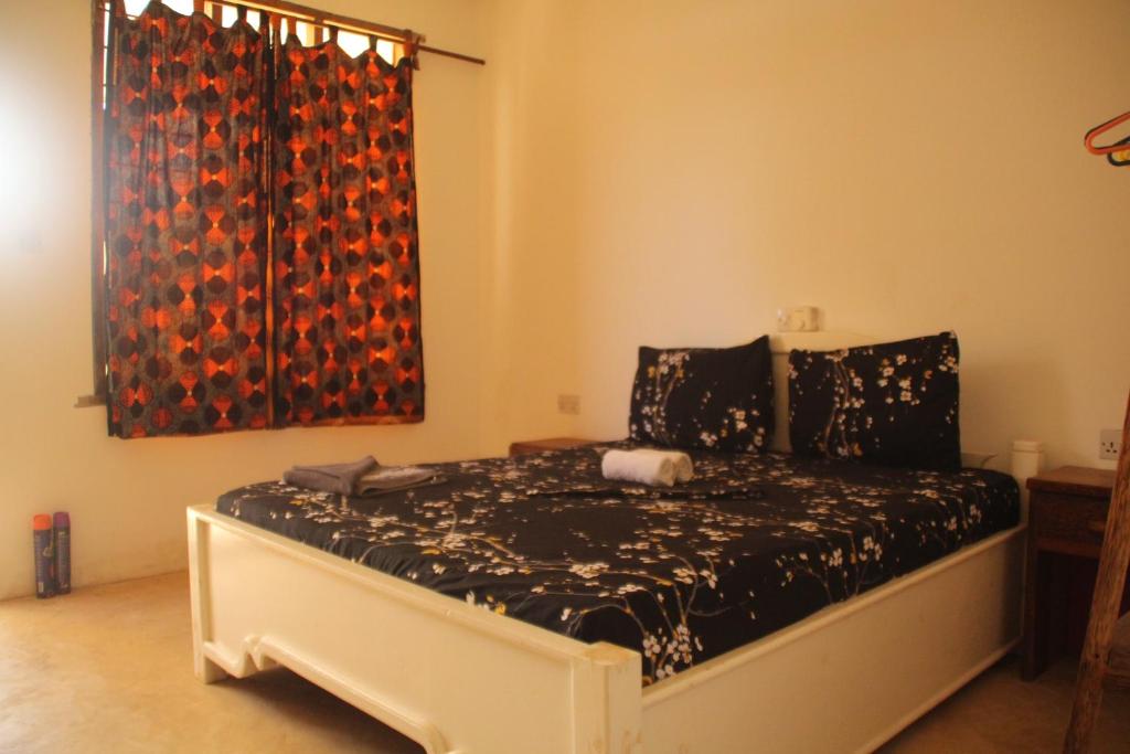 Postel nebo postele na pokoji v ubytování Raphy Home