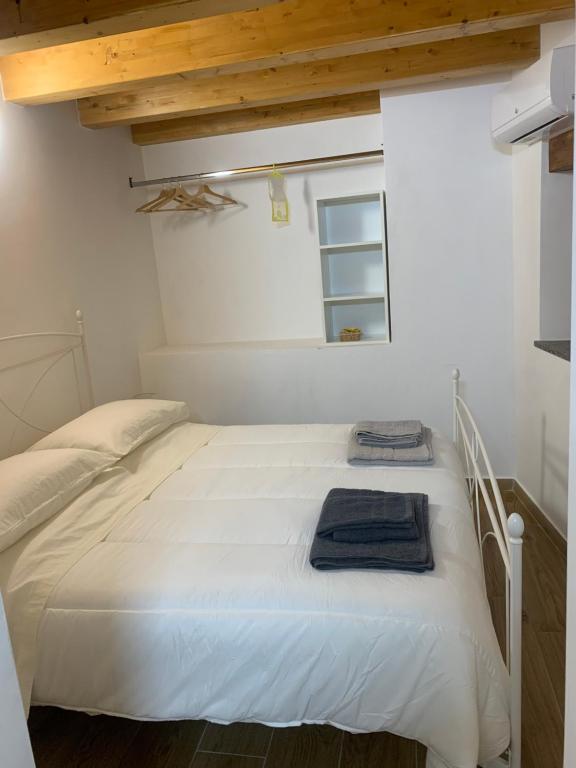 Postel nebo postele na pokoji v ubytování B&B La Ginestra