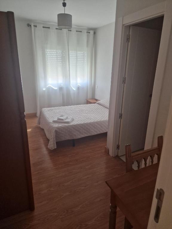 Postel nebo postele na pokoji v ubytování HOSTAL ALTO PÁRAMO