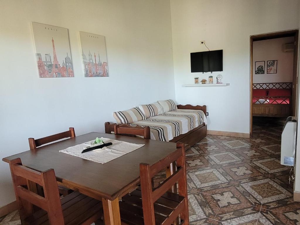 a living room with a table and a couch at Apartamento Del Paseo in Federación