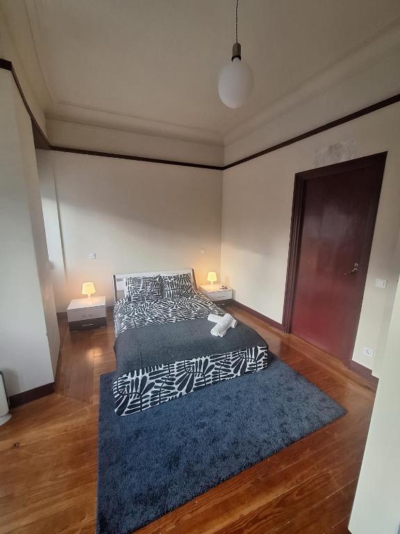 Postel nebo postele na pokoji v ubytování Easy Host Porto