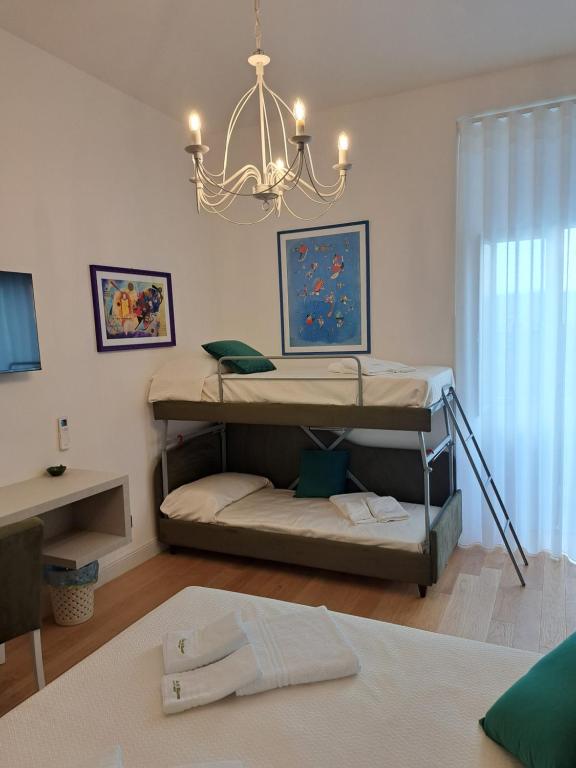 Postel nebo postele na pokoji v ubytování Re Di Rhome Guest House